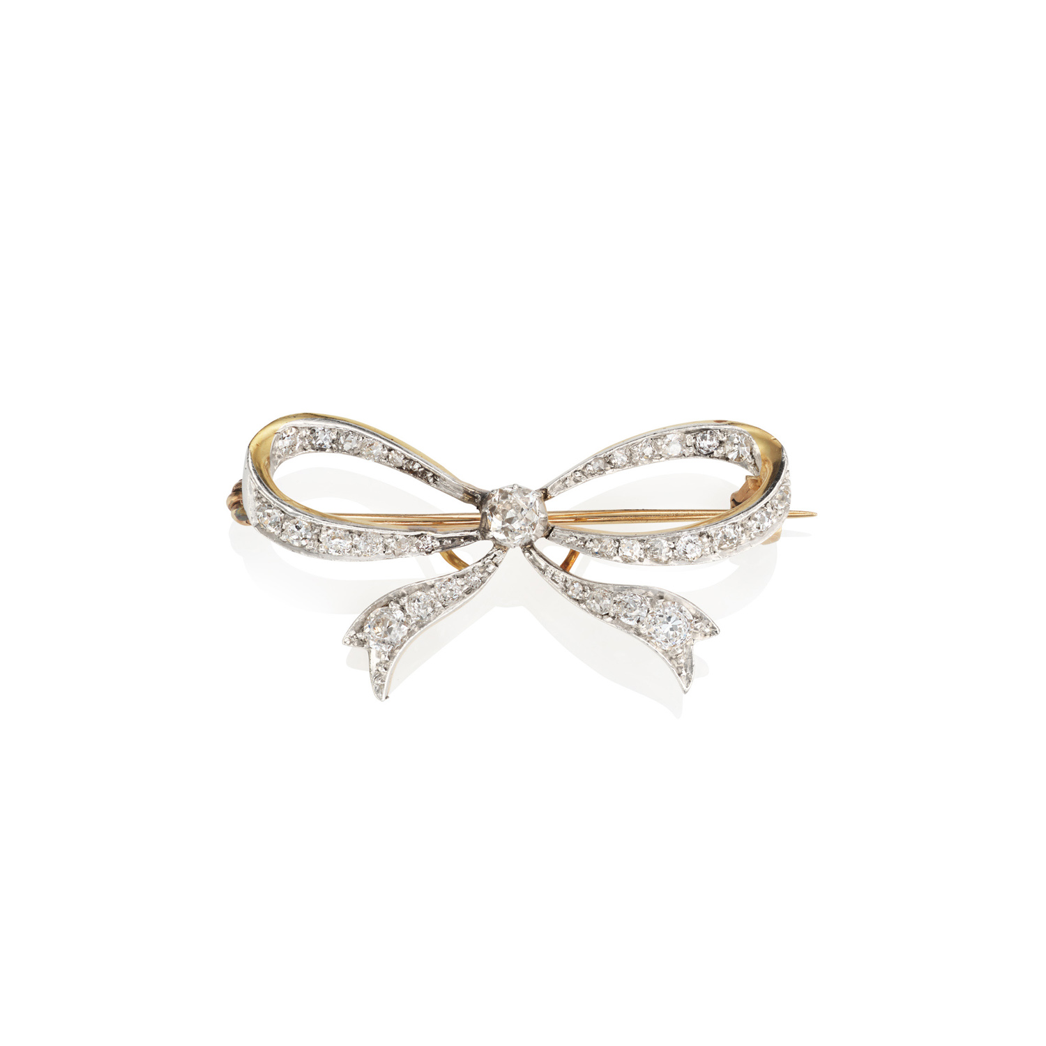 18ct Yellow Gold & Platinum Edwardian Diamond Bow Brooch An Edwardian 18ct yellow gold and platinum diamond tied bow brooch set with old cut and rose cut diamonds.