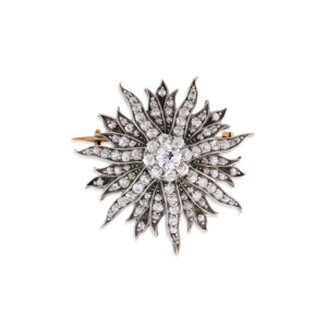 An impressive late Victorian diamond set sunburst brooch containing 100 old cut and rose cut diamonds.