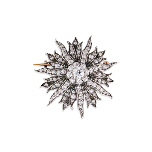 An impressive late Victorian diamond set sunburst brooch containing 100 old cut and rose cut diamonds.