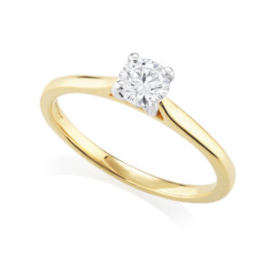 An 18ct yellow gold and platinum single stone diamond solitaire ring from H. L. Brown's Leon Collection.