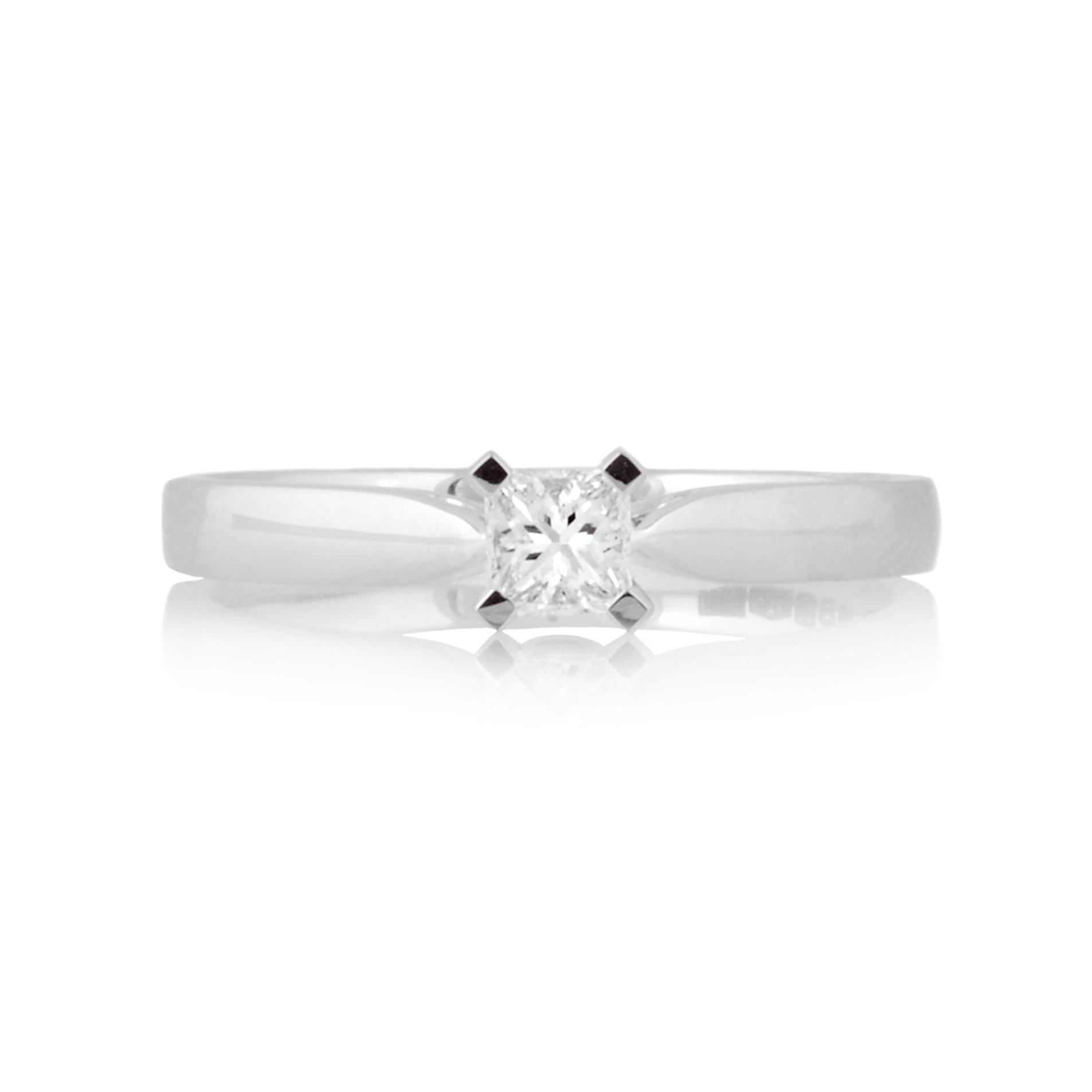 A platinum, princess cut diamond set single stone ring.