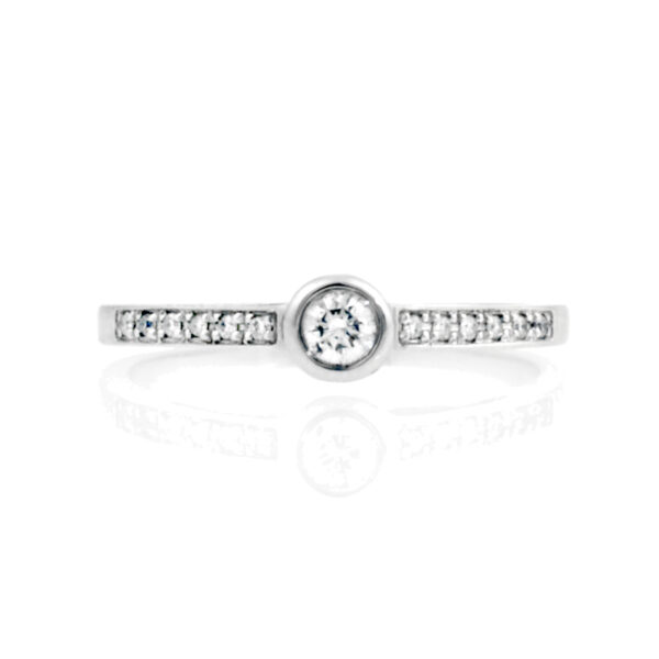 An 18ct white gold round brilliant cut diamond single stone ring with diamond set shoulders.