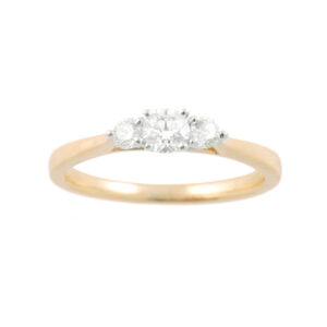 An 18ct yellow and white gold round brilliant cut diamond three stone ring.