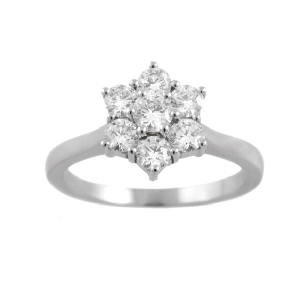 A platinum round brilliant cut diamond seven stone cluster ring with a claw setting.