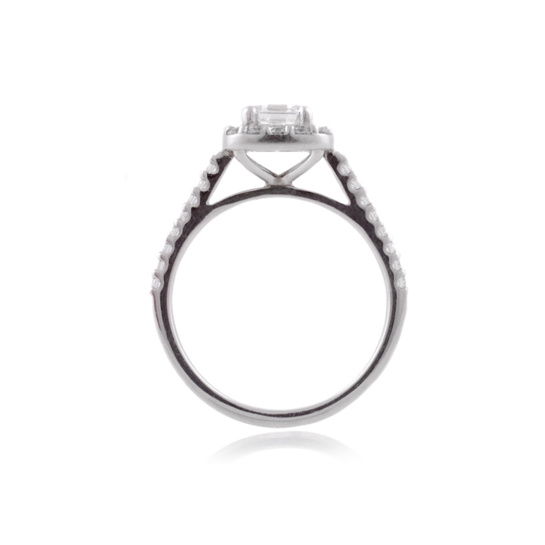 A platinum Asscher cut diamond cluster ring with diamond set shoulders.