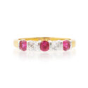 An 18ct gold, ruby and diamond set half eternity ring with five stones.