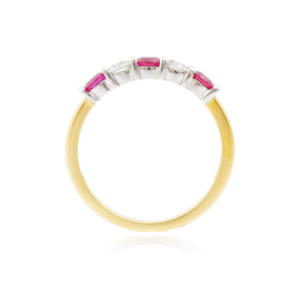 An 18ct gold, ruby and diamond set half eternity ring with five stones.