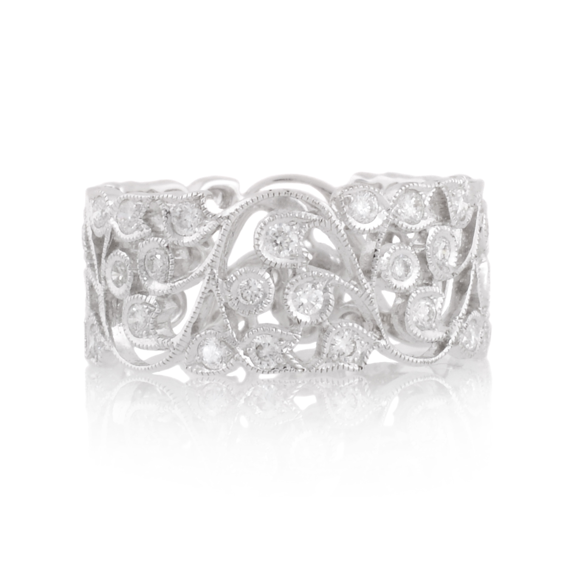 18ct White Gold Diamond Flower & Leaf Band An 18ct white gold, intricate diamond set flower and leaf ring in a band style.
