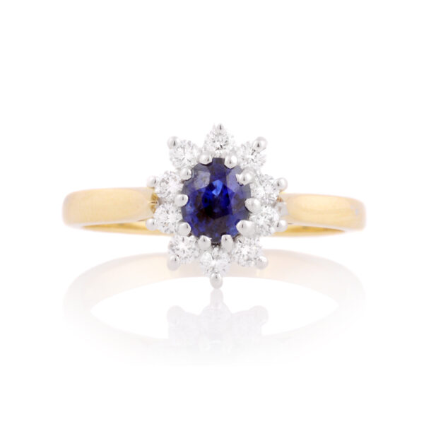 An 18ct gold, sapphire and brilliant cut diamond set cluster ring.