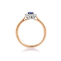 An 18ct gold, oval sapphire and brilliant cut diamond set cluster ring.