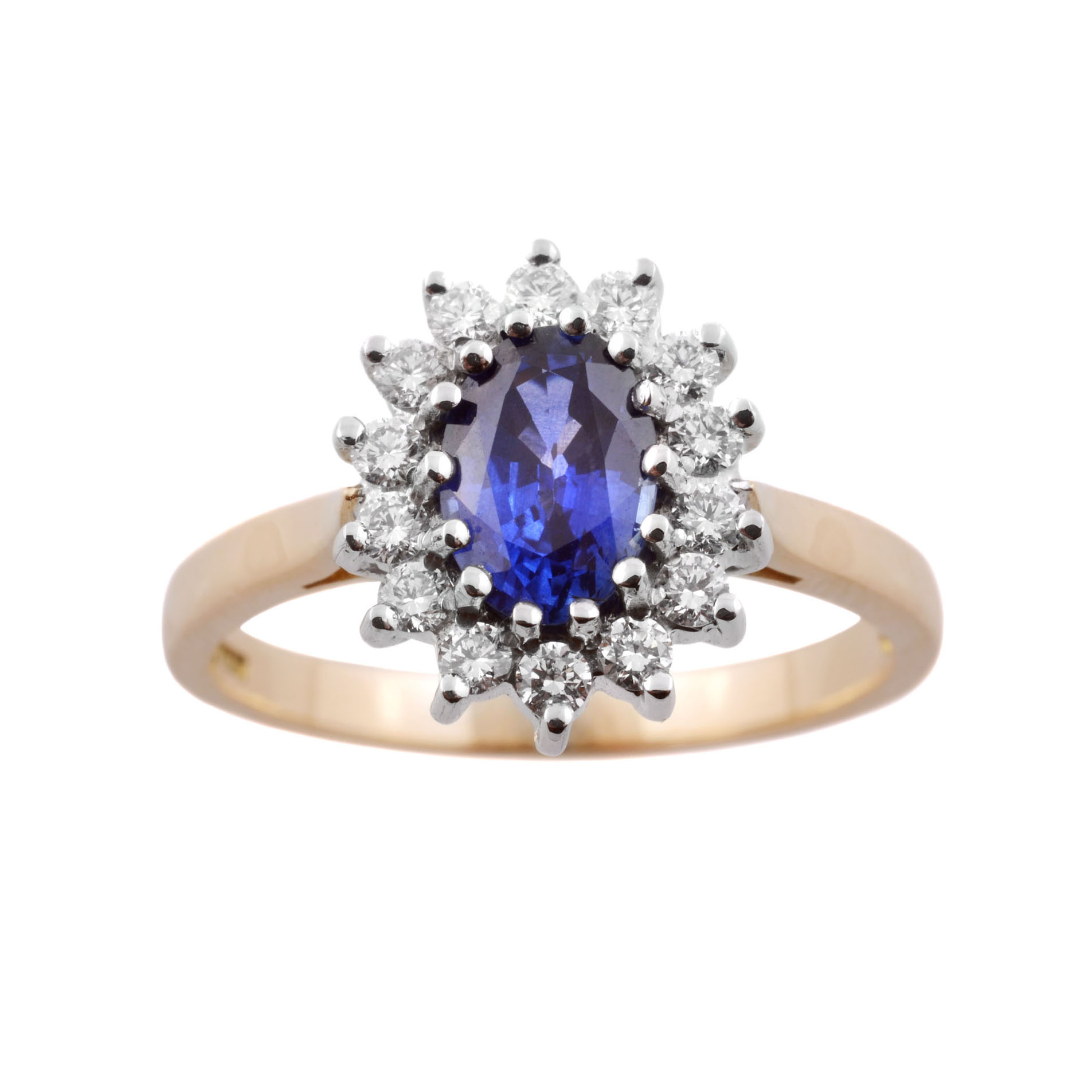 18ct Yellow & White Gold Oval Sapphire & Diamond Cluster Ring An 18ct yellow and white gold oval sapphire and diamond cluster ring.