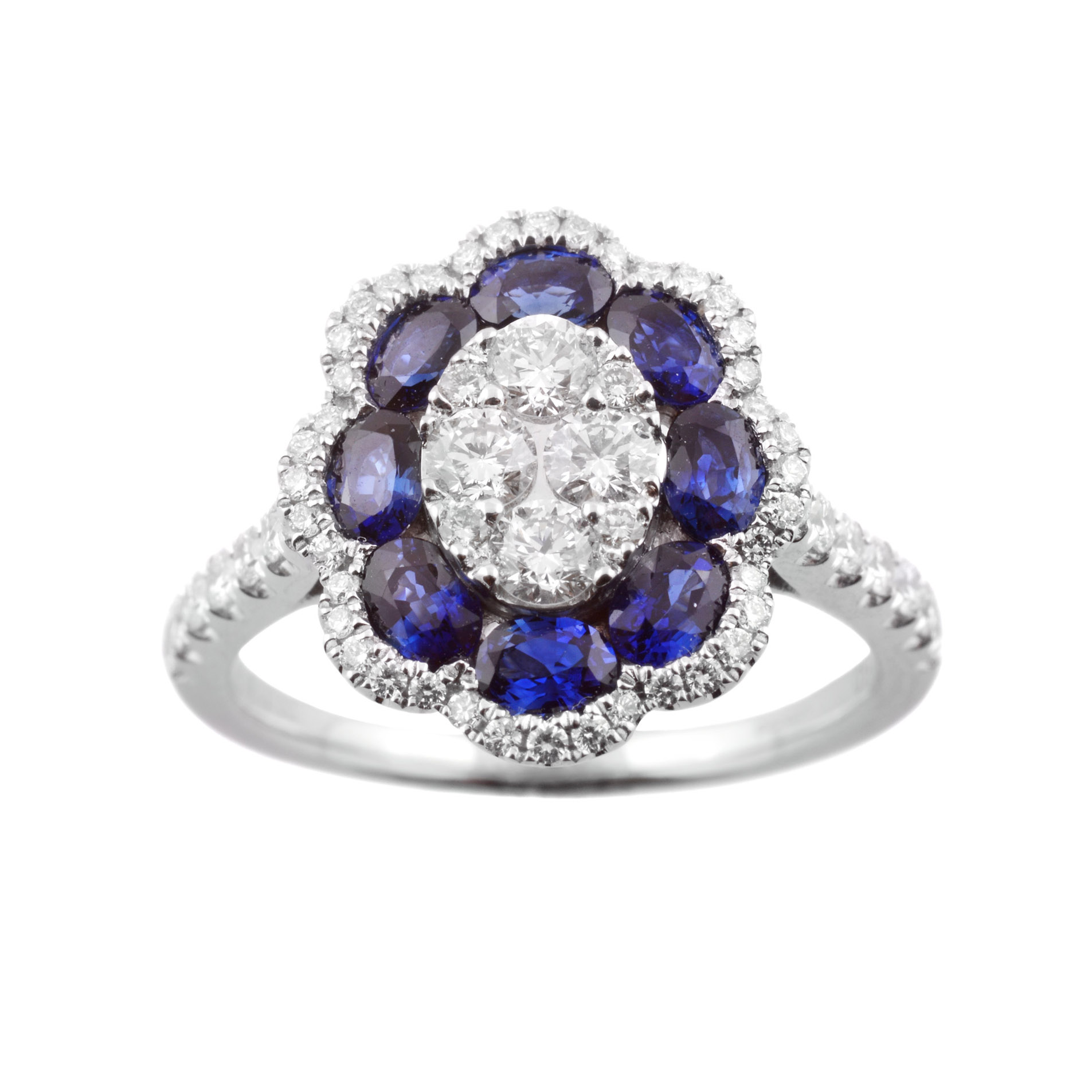 18ct White Gold Sapphire & Diamond Flower Cluster Ring An 18ct white gold oval shaped sapphire and diamond flower cluster ring, with diamond set shoulders.