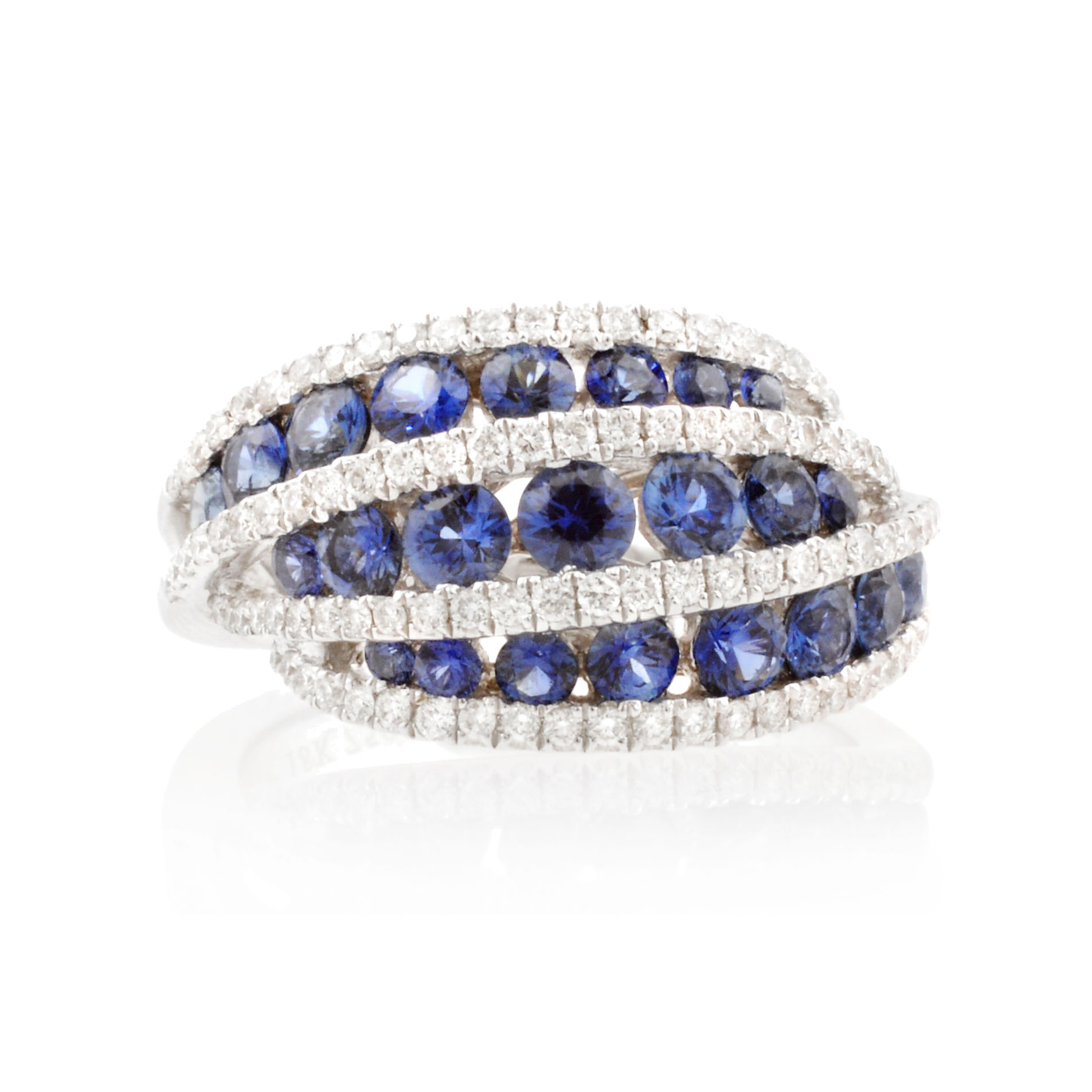 An 18ct white gold, sapphire and diamond swirl set dress ring.