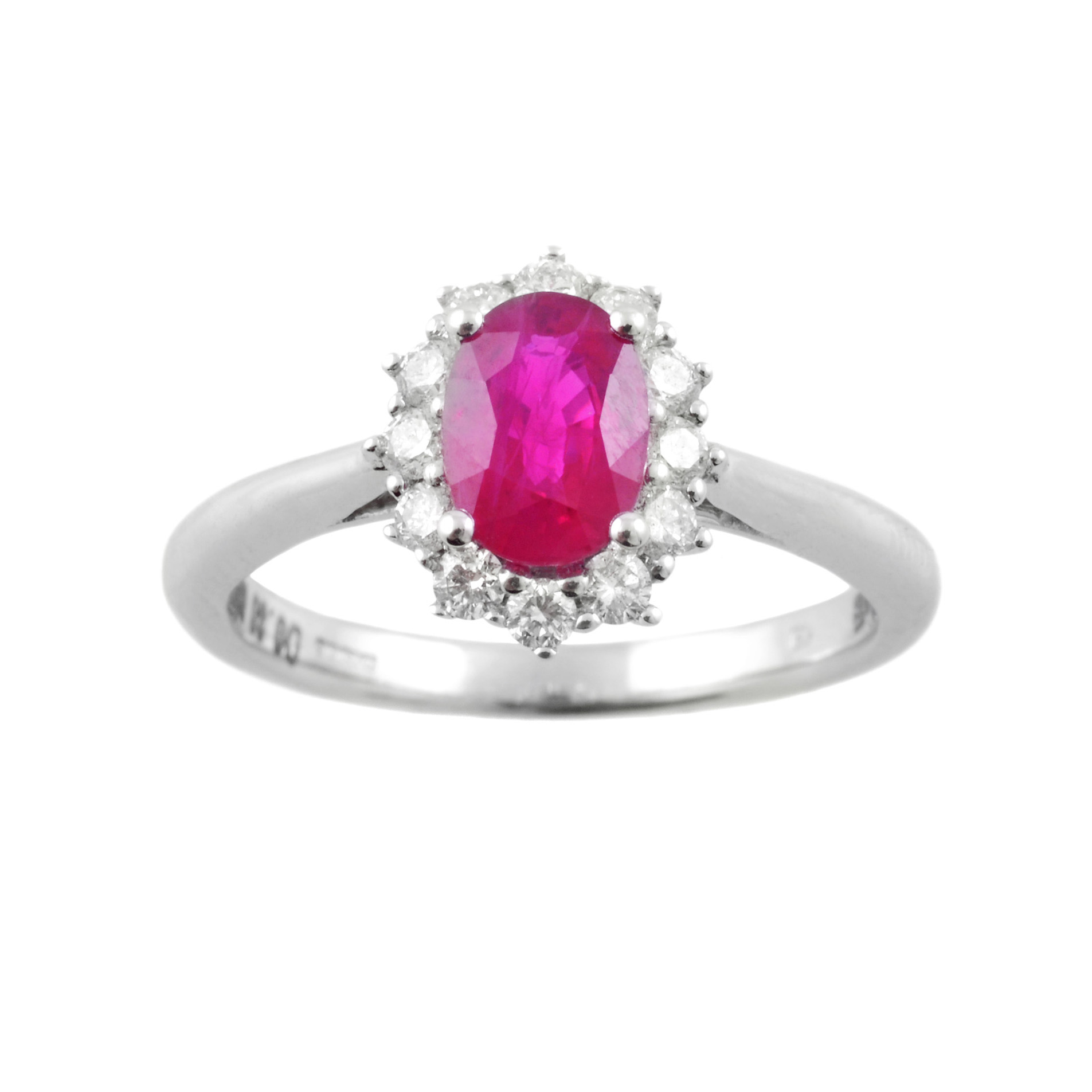 An 18ct white gold oval ruby and brilliant cut diamond cluster ring.