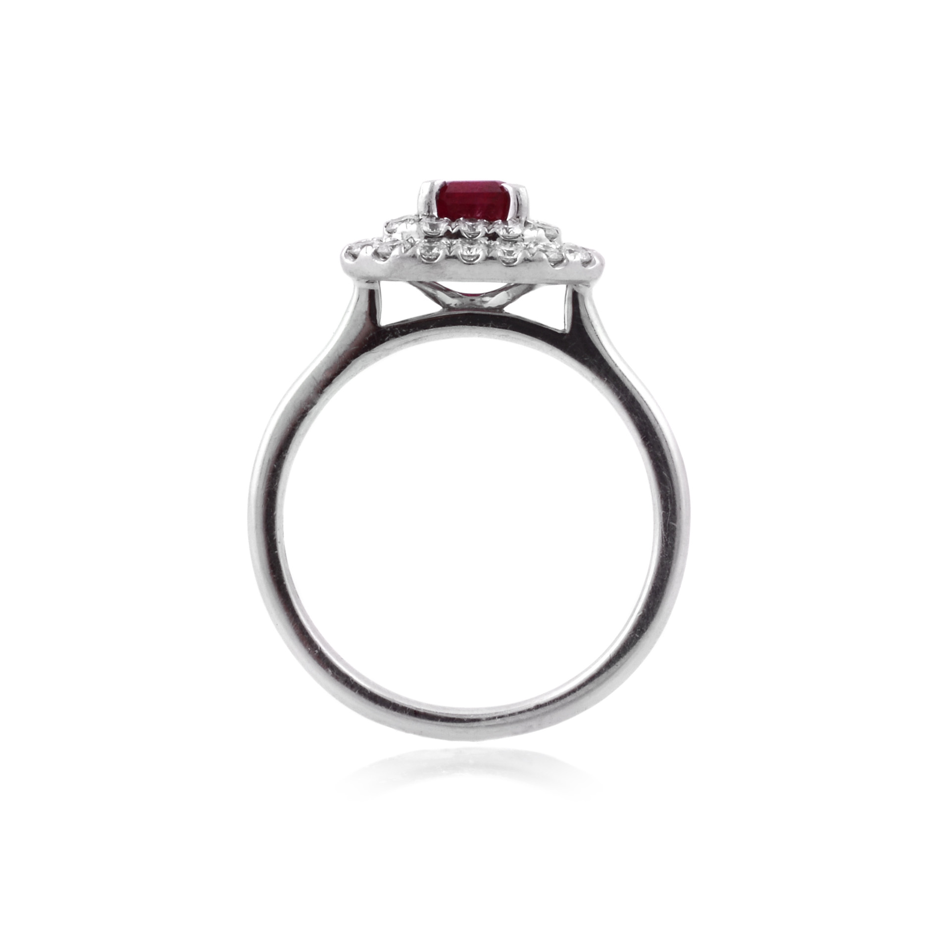 An 18ct white gold, ruby and two-row diamond set fancy cluster ring.