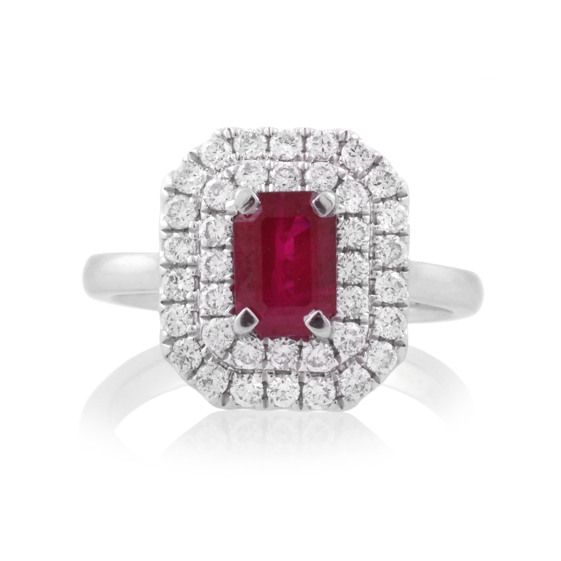 An 18ct white gold, ruby and two-row diamond set fancy cluster ring.