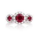 A platinum ruby and brilliant cut diamond set triple cluster ring.