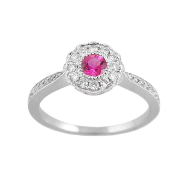 An 18ct white gold, ruby and diamond set millegrain ring with diamond set shoulders.
