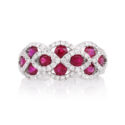 18ct White Gold Ruby & Diamond Set Fancy Cluster Ring An 18ct white gold ruby and diamond set fancy cluster ring with 10 rubies.