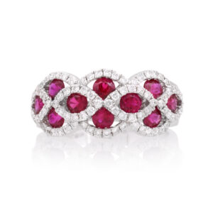 An 18ct white gold ruby and diamond set fancy cluster ring with 10 rubies.