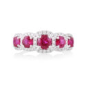 An 18ct white gold, ruby and diamond set five stone fancy cluster ring.