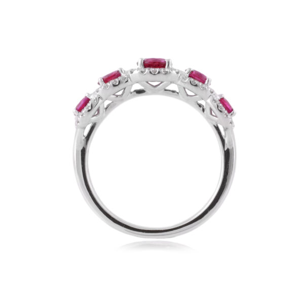 An 18ct white gold, ruby and diamond set five stone fancy cluster ring.