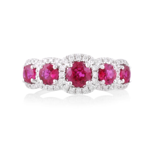 An 18ct white gold, ruby and diamond set five stone fancy cluster ring.