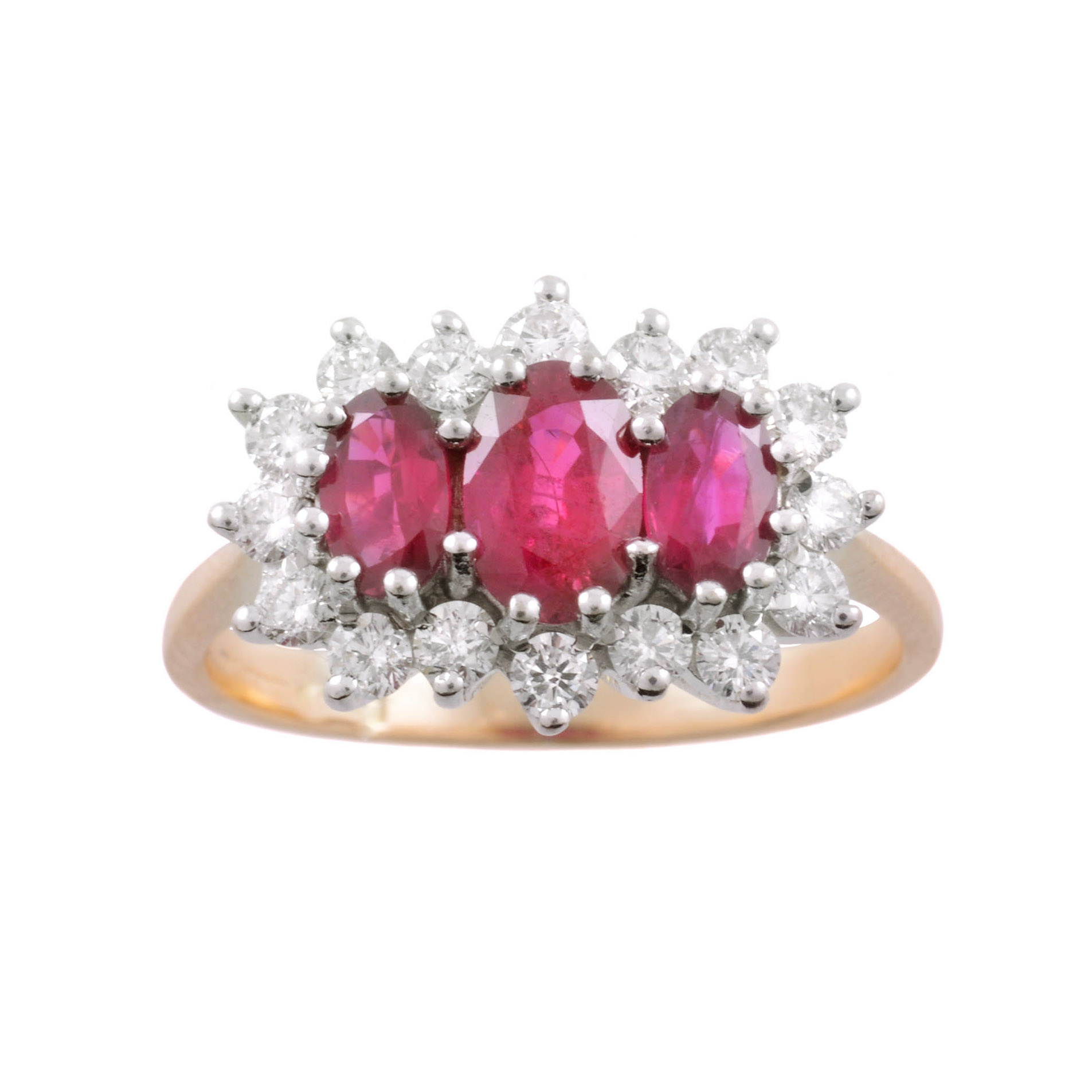 An 18ct yellow and white gold oval ruby and round brilliant cut diamond three stone cluster ring.
