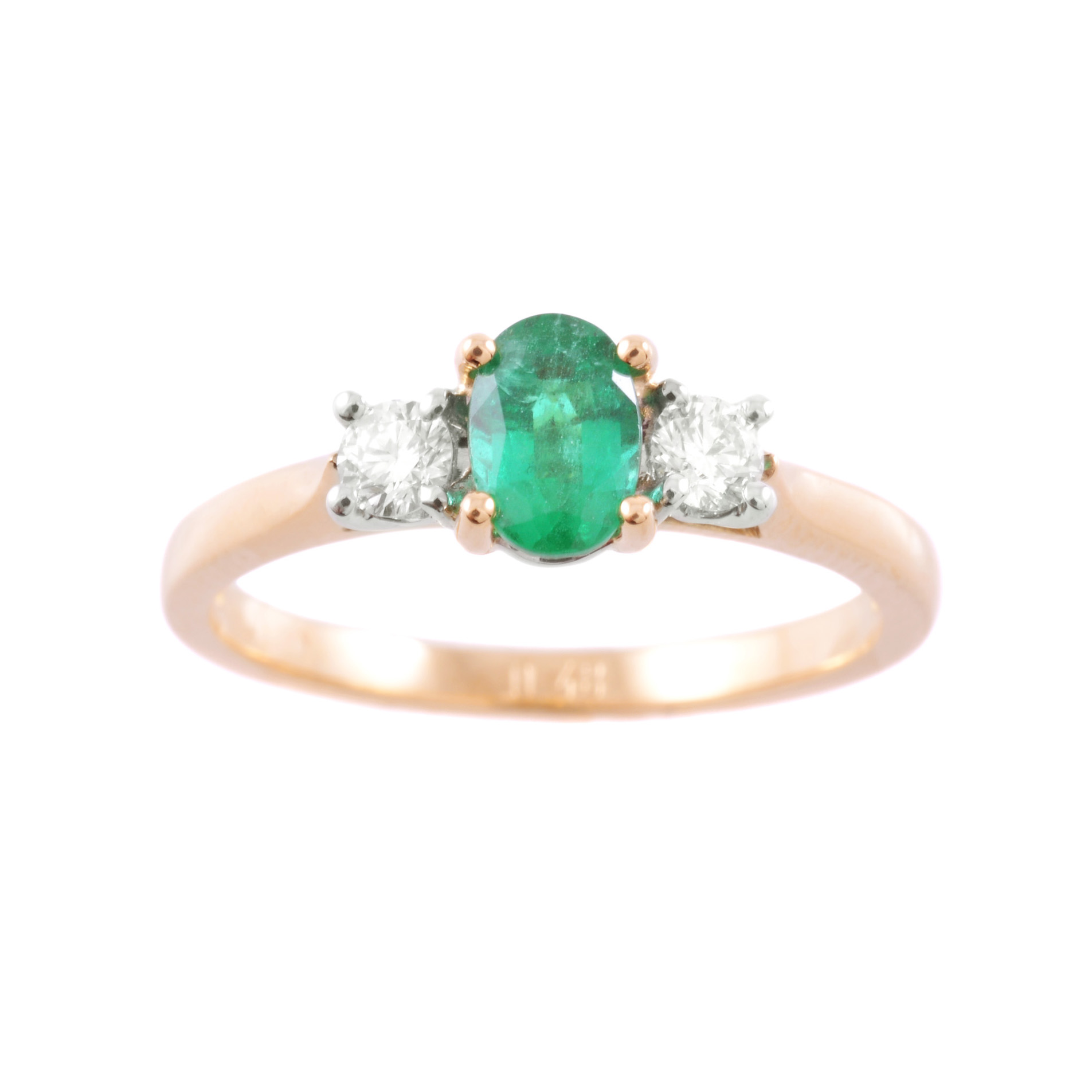 An 18ct yellow and white gold oval emerald and round brilliant cut diamond set ring. Wedding ring friendly.
