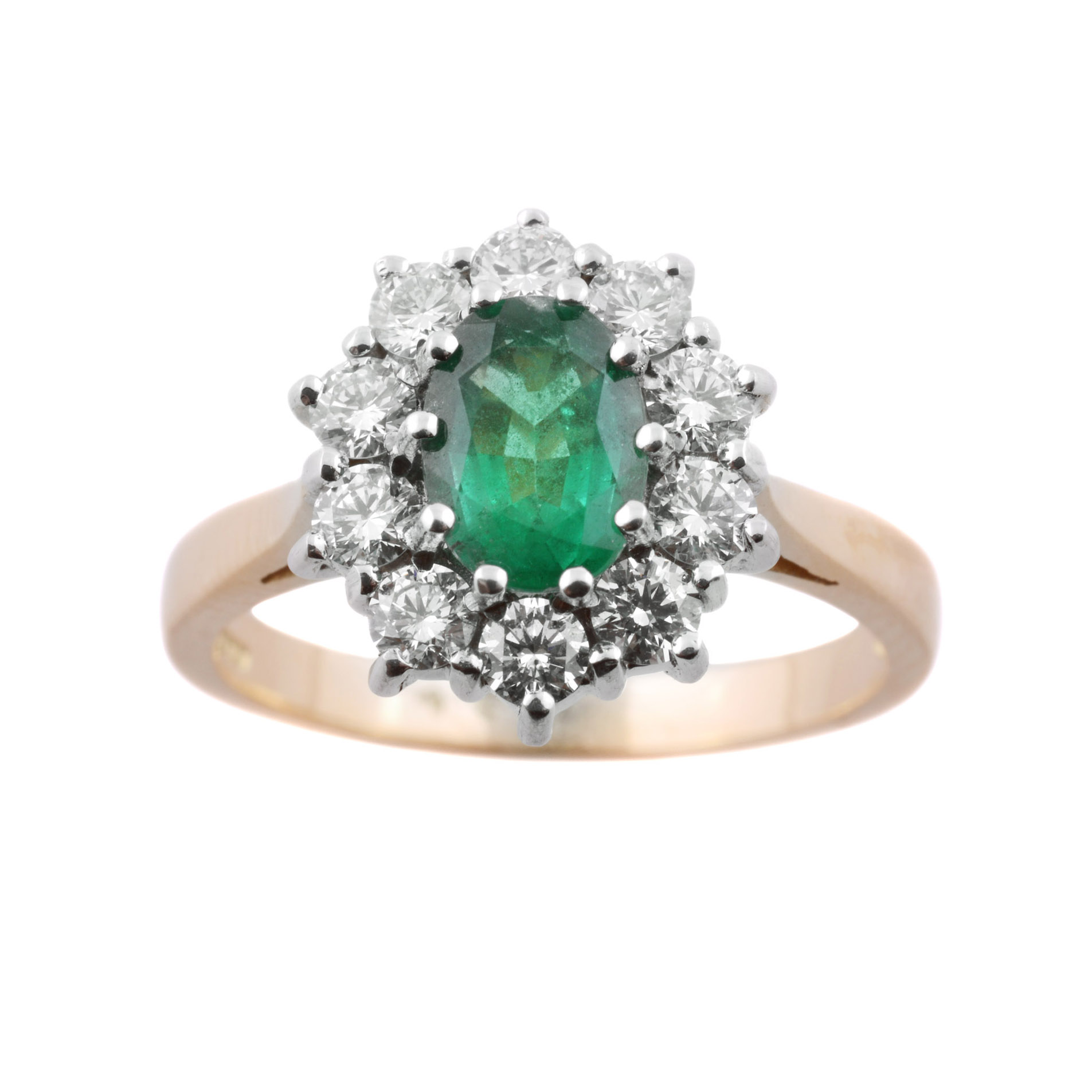 An 18ct yellow and white gold oval emerald and diamond cluster ring.