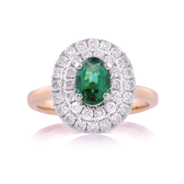 An 18ct yellow gold oval emerald and brilliant cut diamond double row cluster ring.