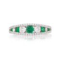 18ct White Gold Emerald & Diamond Fancy Ring An 18ct white gold, emerald and diamond set graduated fancy ring.