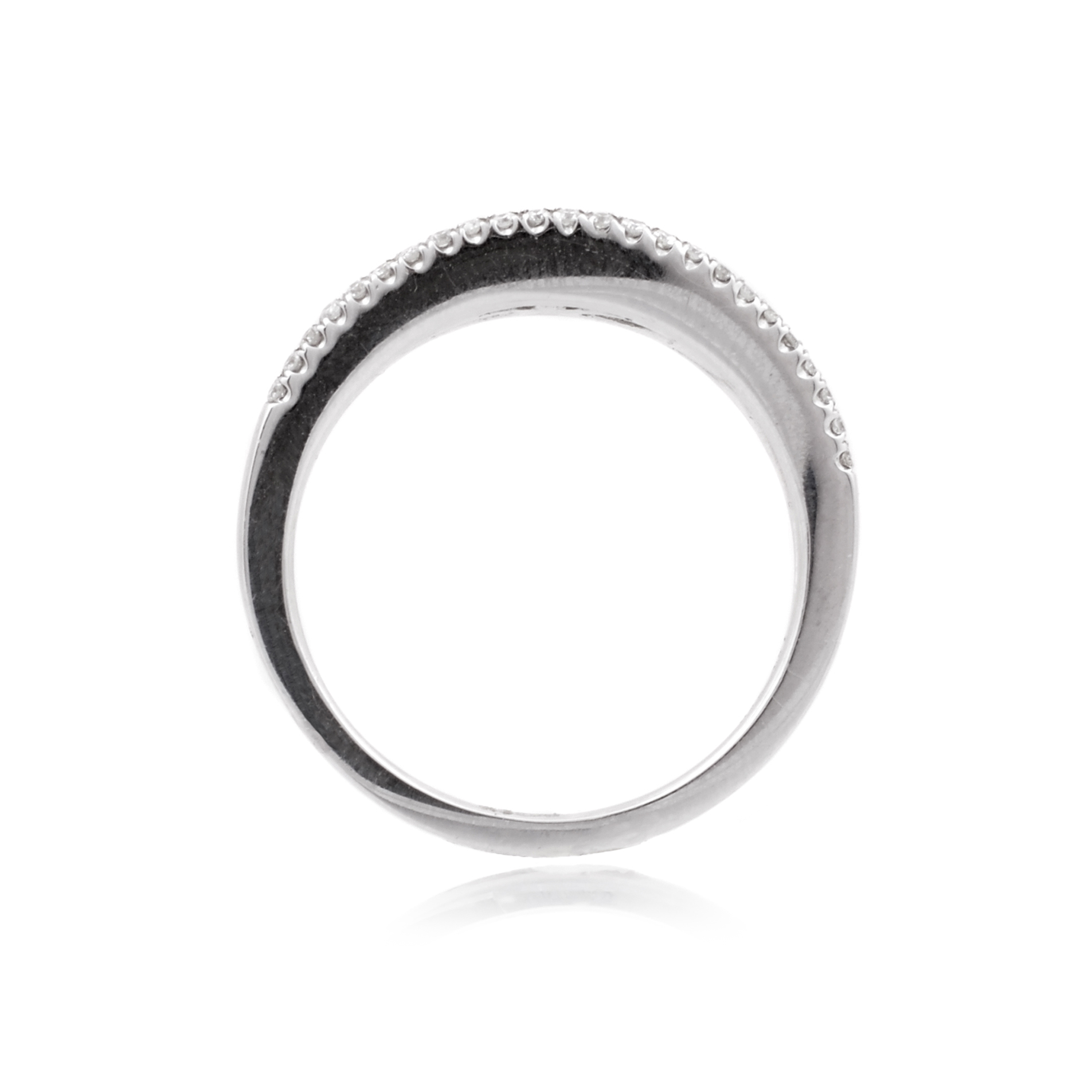 18ct White Gold Emerald & Diamond Fancy Ring An 18ct white gold, emerald and diamond set graduated fancy ring.