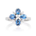 An 18ct white gold nine stone aquamarine and diamond set fancy cluster ring.