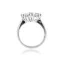 An 18ct white gold nine stone aquamarine and diamond set fancy cluster ring.