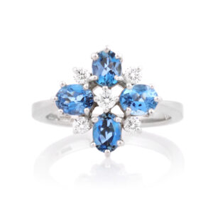 An 18ct white gold nine stone aquamarine and diamond set fancy cluster ring.