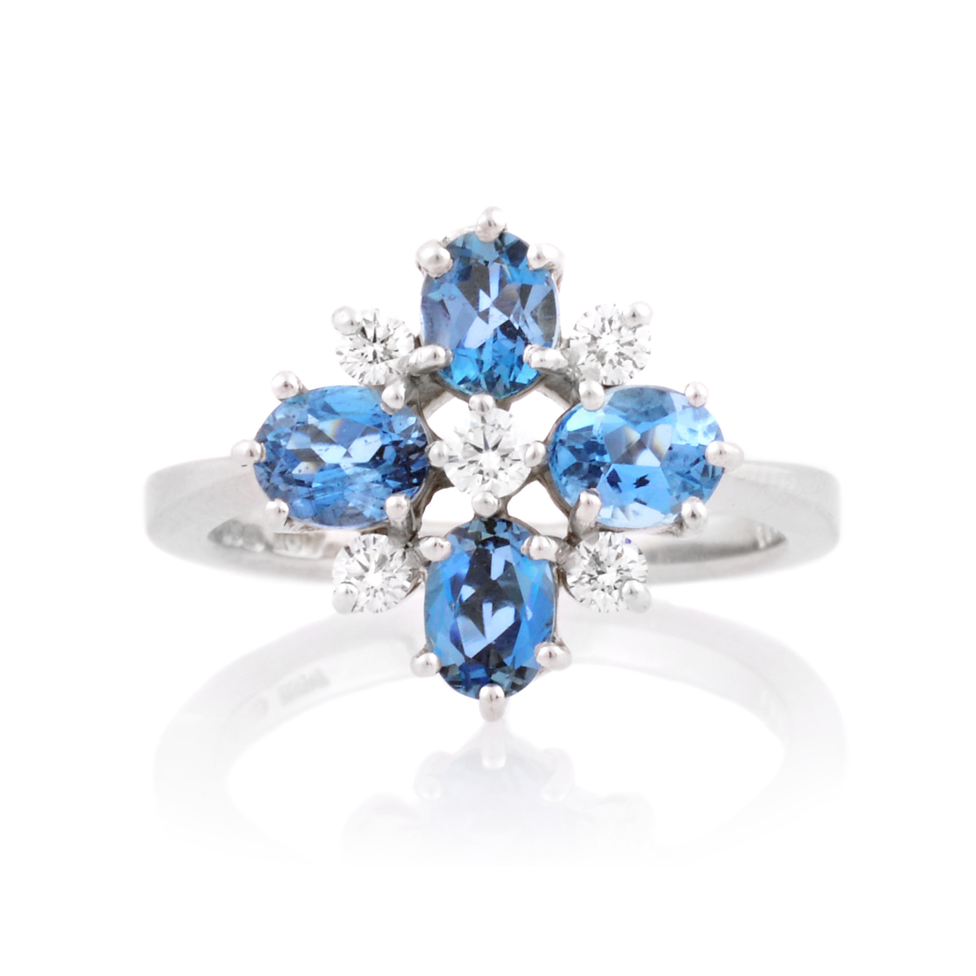 18ct White Gold Aquamarine & Diamond Fancy Cluster Ring An 18ct white gold nine stone aquamarine and diamond set fancy cluster ring.