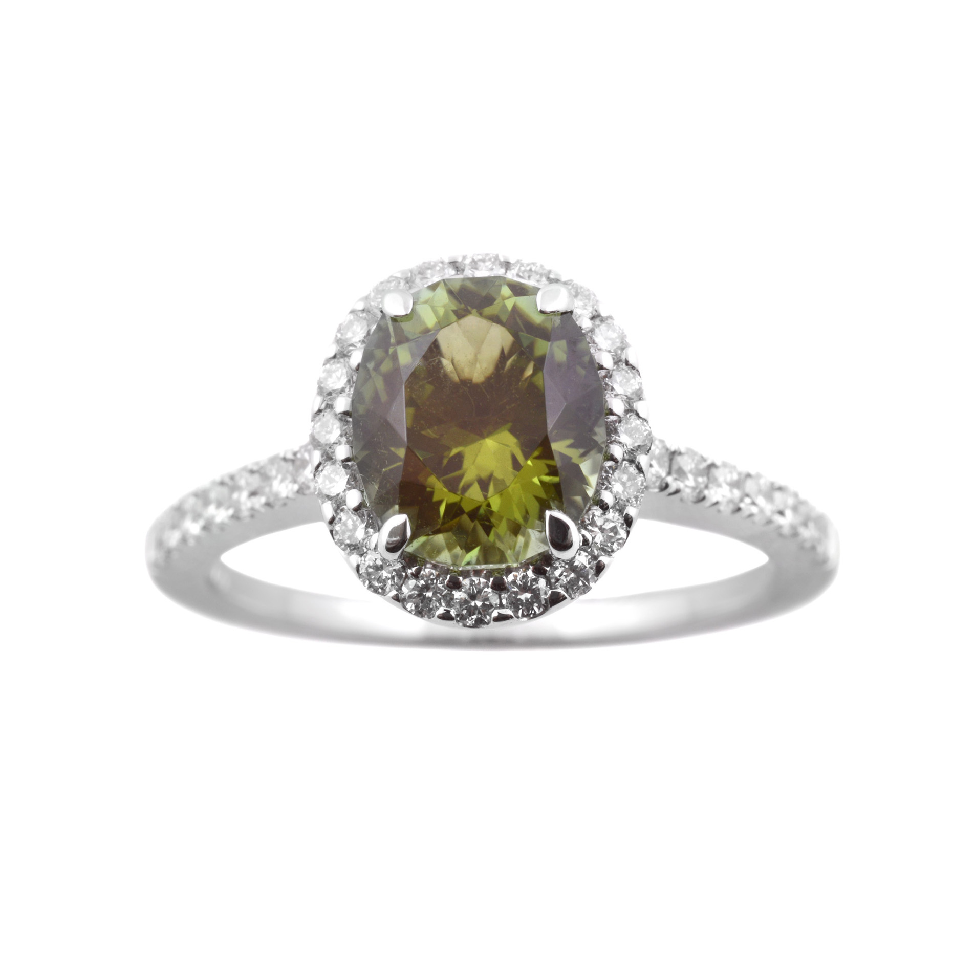 18ct White Gold Oval Green Tourmaline & Diamond Cluster Ring An 18ct white gold green, oval tourmaline and diamond set cluster ring, with diamond set shoulders.