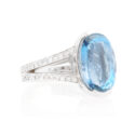 An 18ct white gold large aquamarine and diamond set dress ring with diamond set split shoulders.