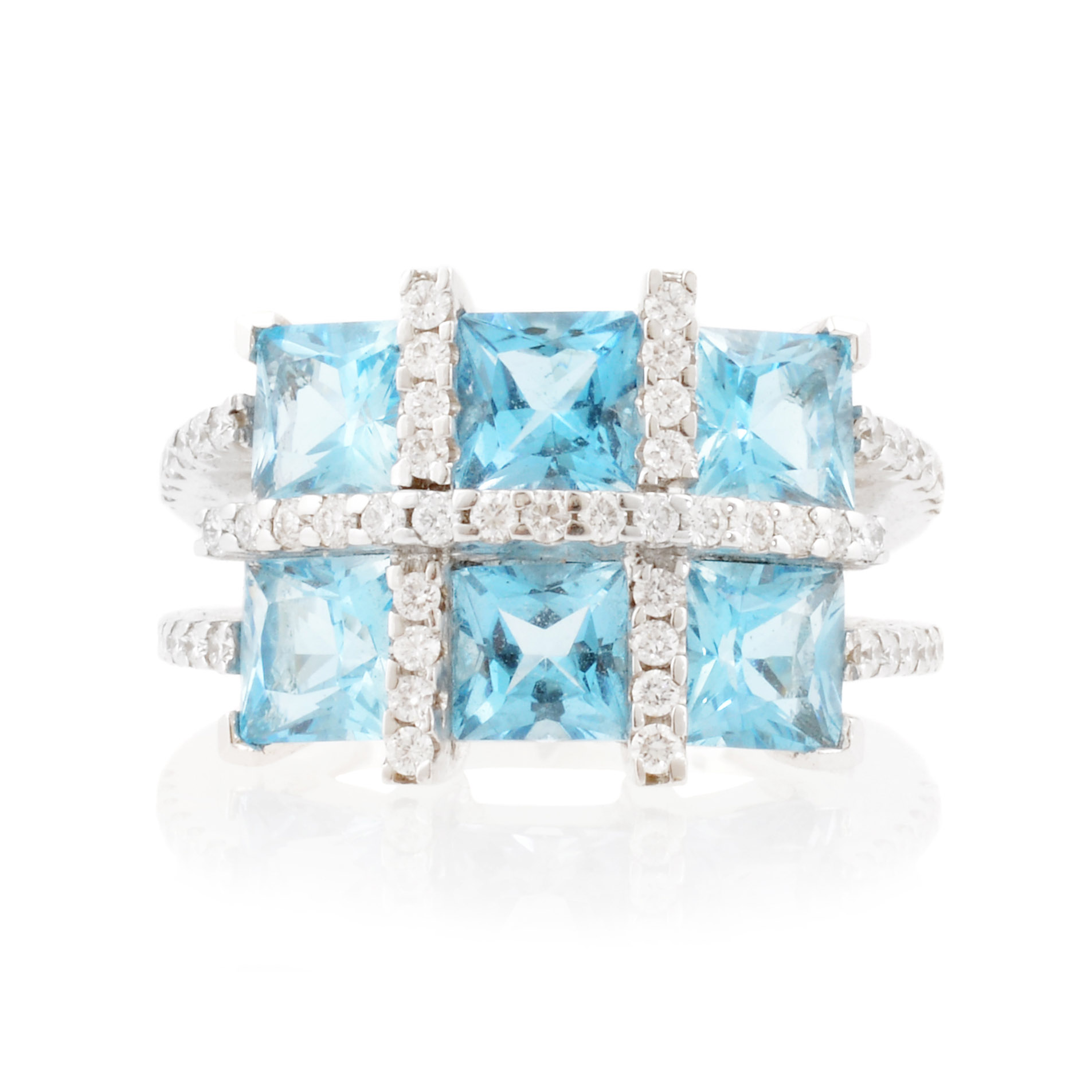 An 18ct white gold blue topaz six stone fancy cluster ring with diamonds set to the shoulders.