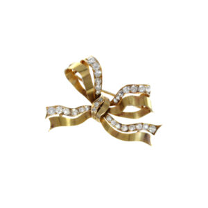 An 18ct yellow gold diamond set bow brooch.