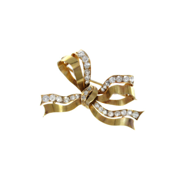 An 18ct yellow gold diamond set bow brooch.