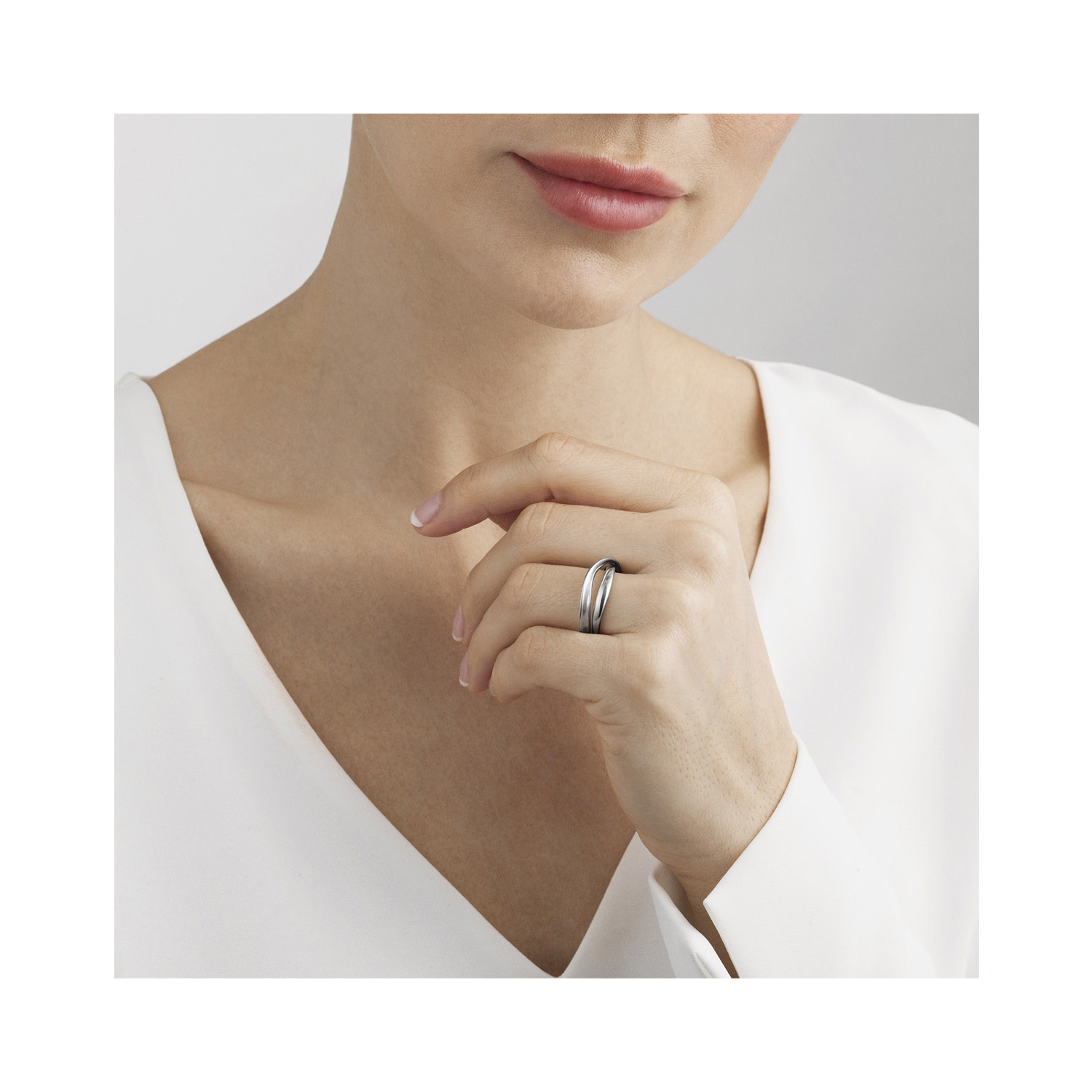 A polished, sterling silver double loop ring from Georg Jensen's Möbius collection.