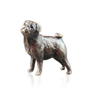 Made from solid foundry bronze, this piece depicts a small, standing pug dog.