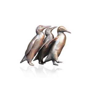 Made from solid foundry bronze, this endearing piece depicts three playful penguins standing together.