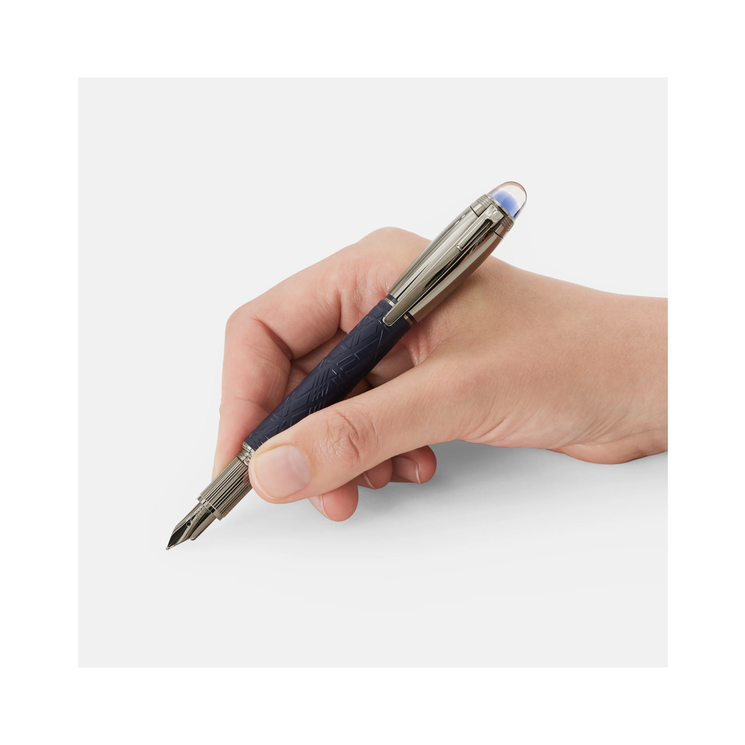A Montblanc, StarWalker SpaceBlue Doué Fountain Pen crafted in deep space blue coloured precious resin with the metal cap and fittings coated in dark ruthenium and a handcrafted, rhutenium-coated Au585 gold nib.