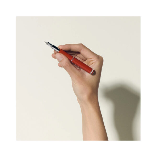 A Montblanc, Heritage Rouge et Noir "Baby" Special Edition Coral-Coloured Fountain Pen crafted from coral coloured precious laquer with platinum-coated fittings featuring an Au 585 solid gold nib.