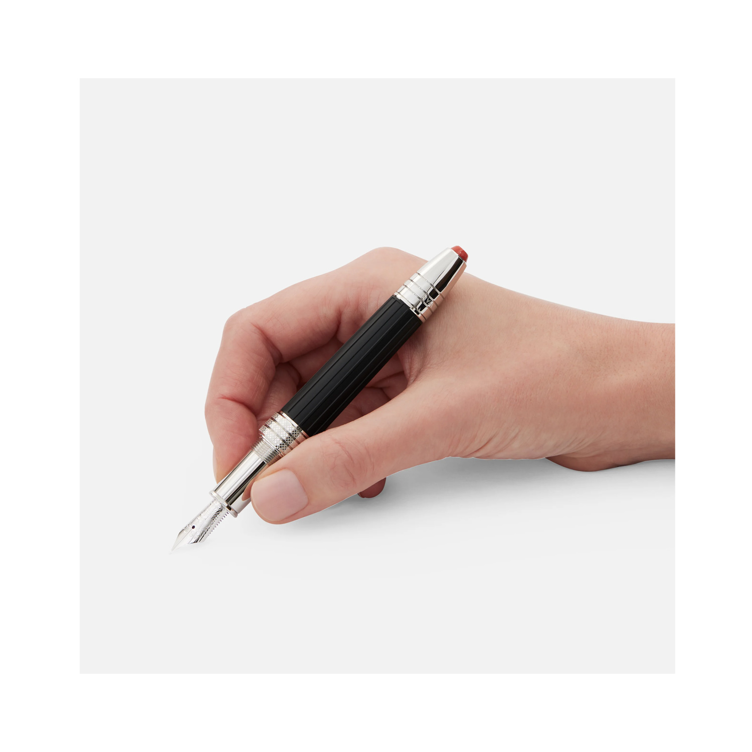 Montblanc, Great Characters Jimi Hendrix Special Edition Fountain Pen A Montblanc, Great Characters Jimi Hendrix Special Edition Fountain Pen crafted from black precious resin featuring a platinum-coated clip resembling the vibrato bar of an electric guitar and a handcrafted Au 585 solid gold nib with rhodium coating bearing a portrait of Jimi Hendrix.