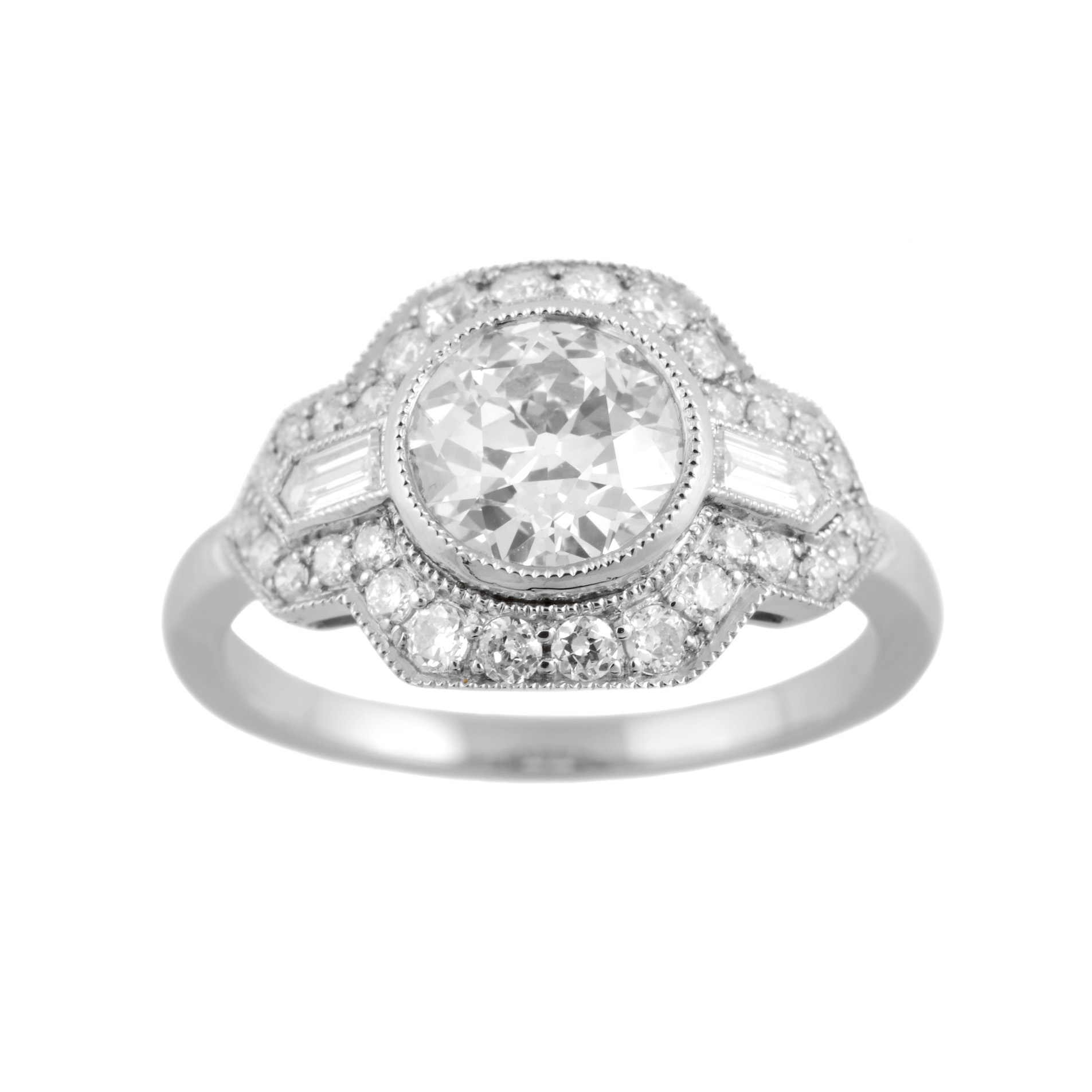 An old European cut diamond, milligraine set, within a mount set with brilliant cut and baguette cut diamonds.