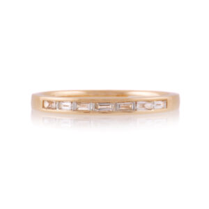 An 18ct gold, baguette cut diamond set seven stone band.